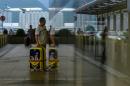 China slams HK airport protesters, US 'deeply concerned'