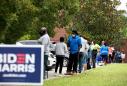 “I would have waited all day if I had to”: Hours-long lines mar first day of early voting in Georgia
