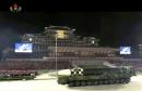 North Korea holds rare nighttime military parade, shows off possible new monster missile