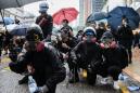 Shot HK protester charged by police, as gov moves to 'ban face masks'