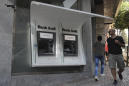 Lebanese banks to reopen as withdrawal limits made official
