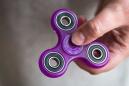 Experts poke holes in claims that fidget spinners can treat ADHD