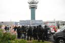 Flights resume at Paris airport, investigators grill attacker's family