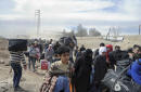 The Latest: Russia says 30,000 flea besieged east Ghouta