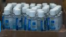 Retailer charged with hoarding, price gouging on sanitizer