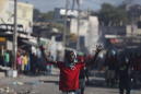 Barricades burn as Haiti enters 4th week of deadly protests