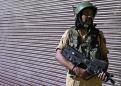 Lockdown in Indian Kashmir as thousands more troops sent