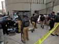 Gunmen raided Pakistan's largest stock exchange, killing at least 3 people before police shot them dead, officials say