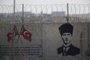 The Latest: Turkey sends reinforcements to border with Syria