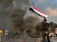 Iraq officials: 1 dead as protesters take a Baghdad highway