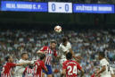 Madrid and Atletico draw in derby, Barcelona stays ahead