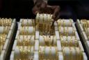 India gold prices hit record high on global cues, weak rupee